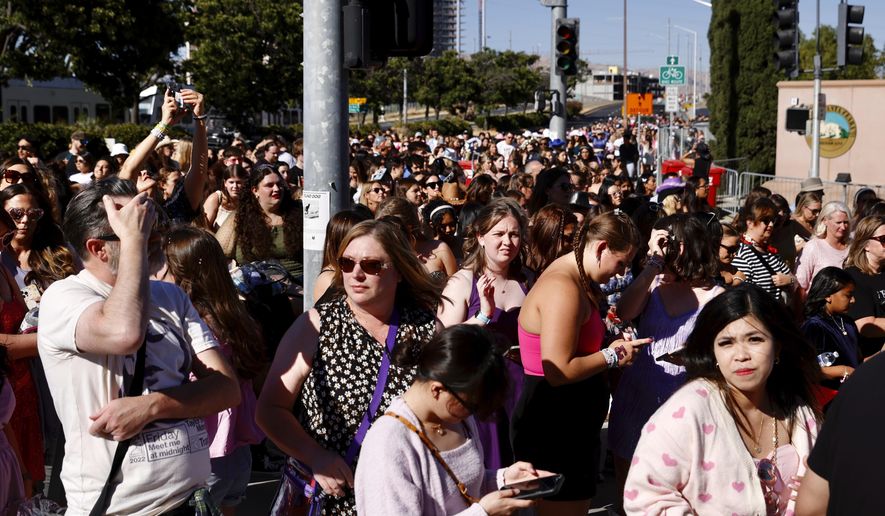 Fans wait to go through security before Taylor Swift performs at Levi's Stadium in Santa Clara, Calif. on July 28, 2023. The 2022 fiasco after there were a myriad of problems with fans trying to buy tickets for Swift's massive "Eras" tour shone a light on cracks in the ticketing system. (Jessica Christian/San Francisco Chronicle via AP, File)
