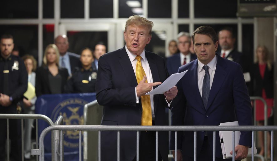 Former President Donald Trump speaks alongside his attorney Todd Blanche following the day's proceedings in his trial Tuesday, May 21, 2024, in Manhattan Criminal Court in New York. (Michael M. Santiago/Pool Photo via AP)
