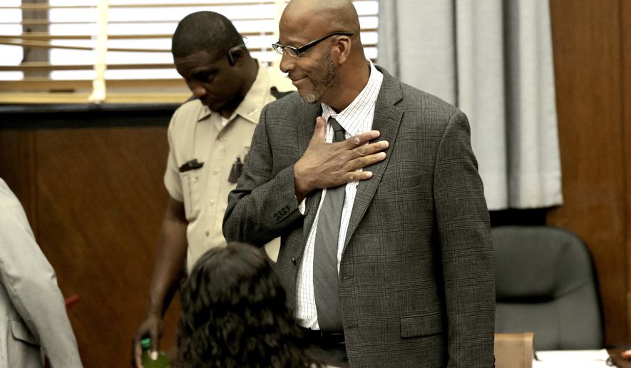 FILE - Christopher Dunn arrives in court, May 21, 2024, at the Carnahan Courthouse in St. Louis. A St. Louis judge is now deciding the fate of Christopher Dunn, who has been imprisoned more than three decades for a murder he says he didn't commit. St. Louis Circuit Attorney Gabe Gore believes him, and requested the hearing to determine if Dunn's conviction should be vacated. It isn't clear when Judge Jason Sengheiser will issue a ruling. The two-day hearing concluded Wednesday, May 22, 2024. (Laurie Skrivan/St. Louis Post-Dispatch via AP, Pool)
