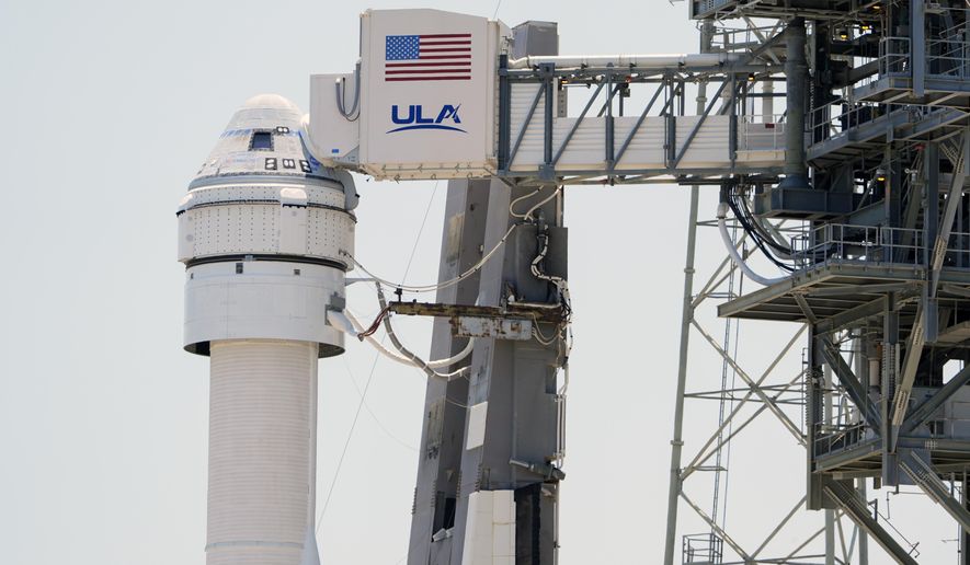 Boeing's Starliner capsule atop an Atlas V rocket is seen at Space Launch Complex 41 at the Cape Canaveral Space Force Station a day after its mission to the International Space Station was scrubbed because of an issue with a pressure regulation valve, Tuesday, May 7, 2024, in Cape Canaveral, Fla. Boeing is now aiming for its first astronaut launch at the beginning of June. Officials for the company and NASA said Friday, May 24, that weeks of review show that the capsule can safely fly with two test pilots, despite a small propulsion system leak.(AP Photo/John Raoux, File)