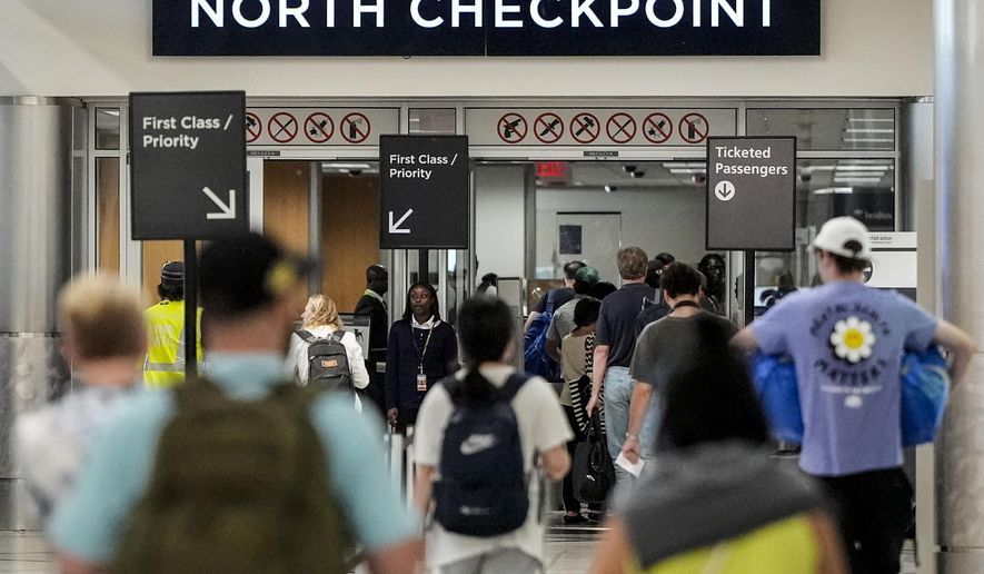 Travelers move through Hartsfield-Jackson Atlanta International Airport ahead of Memorial Day, Friday, May 24, 2024, in Atlanta.(AP Photo/Mike Stewart)