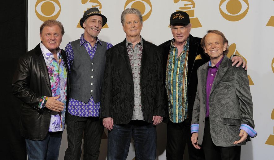 FILE - Bruce Johnston, from left, David Marks, Brian Wilson, Mike Love and Al Jardine of The Beach Boys pose backstage at the 54th annual Grammy Awards in Los Angeles on Feb. 12, 2012. A new documentary about the band premieres May 24 on Disney+. (AP Photo/Mark J. Terrill, File)