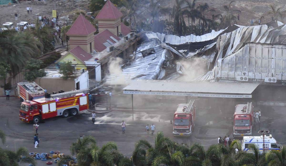 NextImg:At least 22 dead in a fire in an amusement park in western India, police say