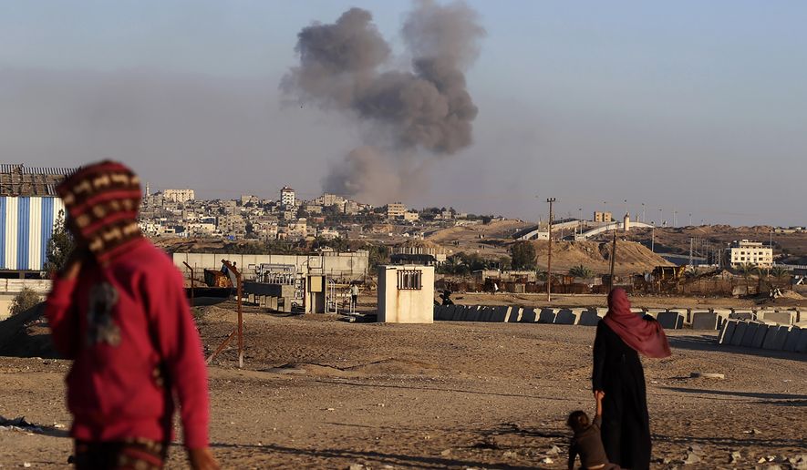 Smoke rises following an Israeli airstrike on buildings near the separating wall between Egypt and Rafah, southern Gaza Strip, Tuesday, May 7, 2024. An order by the top United Nations court for Israel to halt its military offensive in the southern Gaza city of Rafah deepens its disconnect with the United States. (AP Photo/Ramez Habboub, File)