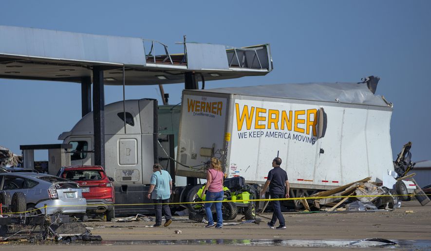 Damage is seen at a truck stop the morning after a tornado rolled through, Sunday, May 26, 2024, in Valley View, Texas. Powerful storms killed multiple people and left a wide trail of destruction Sunday across Texas, Oklahoma and Arkansas after obliterating homes and destroying a truck stop where drivers took shelter during the latest deadly weather to strike the central U.S. (AP Photo/Julio Cortez)