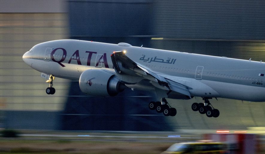 A Qatar Airways plane lands at the airport in Frankfurt, Germany, as the sun rises on Sept. 25, 2023. Twelve people were injured when a Qatar Airways plane flying from Doha to Dublin on Sunday, May 26, 2024, hit turbulence, airport authorities said. (AP Photo/Michael Probst, File)