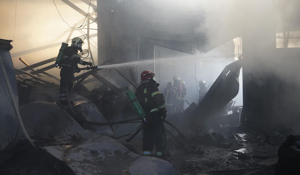 NextImg:The death toll in Kharkiv attack rises to 14 as Zelenskyy warns of Russian troop movements