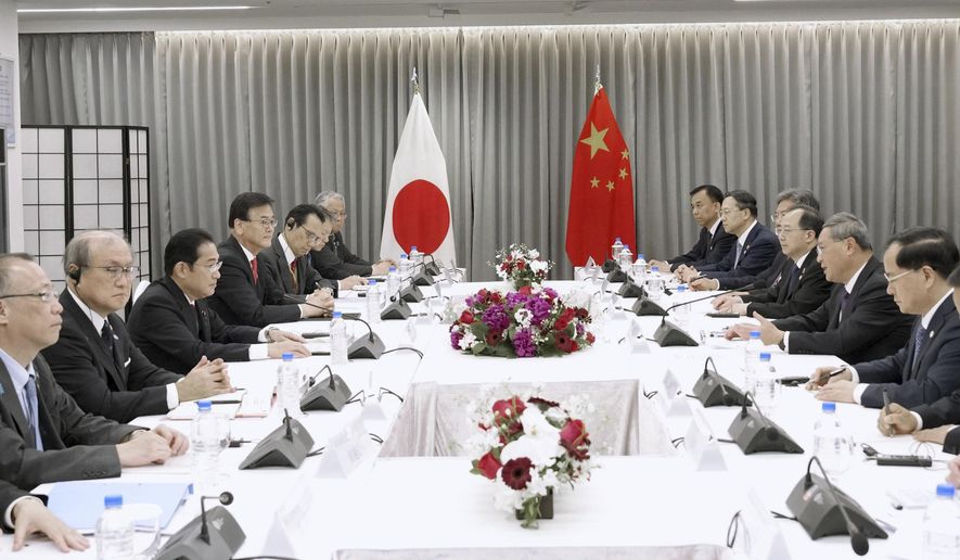 Japanese Prime Minister Fumio Kishida, third left, holds a meeting with Chinese Premier Li Qiang, third right, in Seoul, South Korea, Sunday, May 26, 2024. (Daisuke Suzuki/Kyodo News via AP)