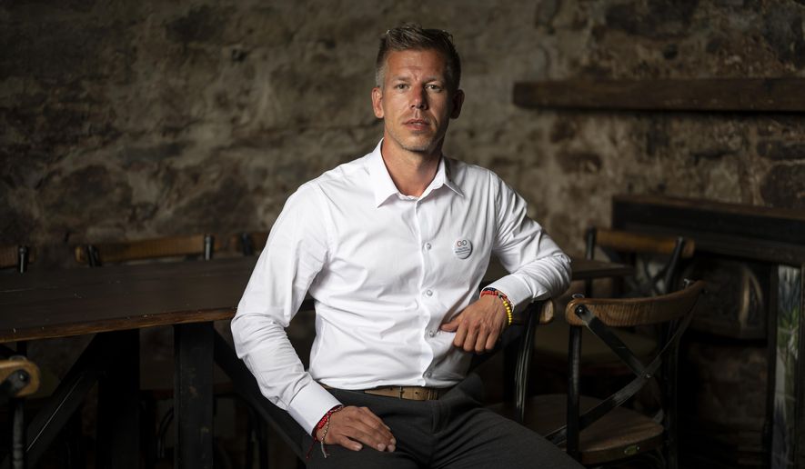 Péter Magyar, a former Fidesz insider that broke ranks with the party in February, poses for a portrait after an interview with The Associated Press in Vac, Hungary, on May 18, 2024. Magyar, 43, seized on growing disenchantment with the populist Prime Minister Viktor Orbán, building a political movement that in only a matter of weeks looks poised to become Hungary's largest opposition force. (AP Photo/Denes Erdos)