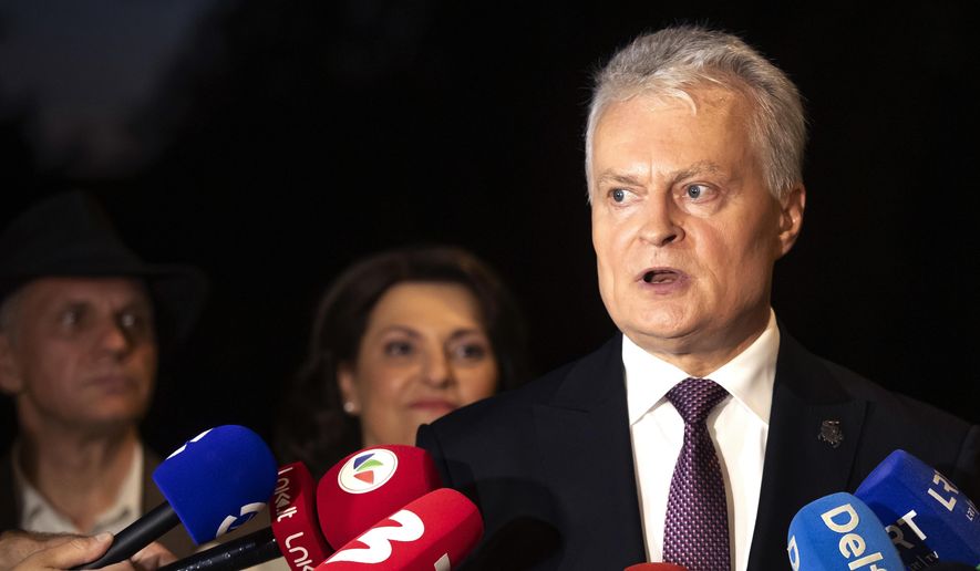 Lithuania's President Gitanas Nauseda, a presidential candidate, speaks to the media after winning the second round of Lithuania's presidential election, in Vilnius, Lithuania, Sunday, May 26, 2024. (AP Photo/Mindaugas Kulbis)