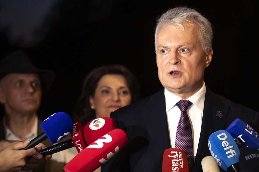 Lithuania's President Gitanas Nauseda, a presidential candidate, speaks to the media after winning the second round of Lithuania's presidential election, in Vilnius, Lithuania, Sunday, May 26, 2024. (AP Photo/Mindaugas Kulbis)