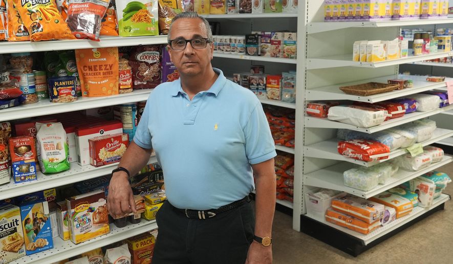 Rob Ranieri, CEO of House of Hope, stands in the food pantry, Tuesday, May 21, 2024, in Stuart, Fla. House of Hope offers food, clothing, financial and life skills to residents of Martin County. The Community Foundation of Martin - St. Lucie counties has overhauled its approach to disaster response by creating a permanent fund and establishing preemptive agreements with nonprofit partners like House of Hope to deploy funds to them immediately when a storm is forecasted. (AP Photo/Marta Lavandier)