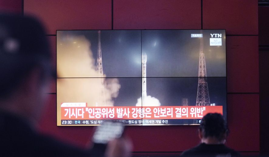 A TV screen shows a file image of North Korea's rocket launch during a news program at a bus terminal in Seoul, South Korea, Monday, May 27, 2024. North Korea on Monday, May 27, 2024, launched a missile into the sea, Japan and South Korea said, hours after North Korea announced plans to put a rocket into orbit apparently carrying its second military reconnaissance satellite. (AP Photo/Ahn Young-joon)