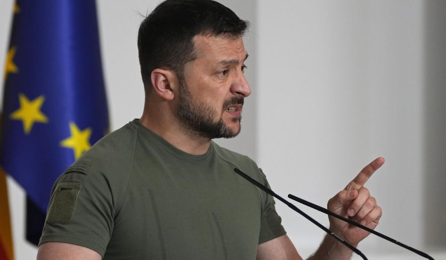 Ukrainian President Volodymyr Zelenskyy speaks during a joint news conference with Spain's Prime Minister Pedro Sanchez at the Moncloa Palace in Madrid, Spain, Monday, May 27, 2024. (AP Photo/Paul White)