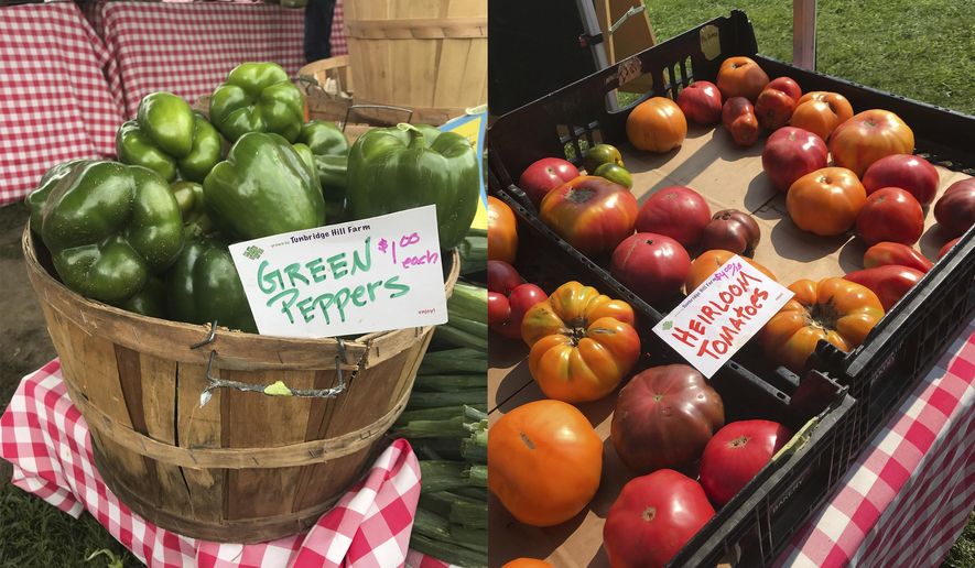 This combination of photos shows green peppers, left and heirloom tomatoes for sale at a farmer's market in Waitsfield, Vt., on Aug. 28, 2021. (AP Photo/Carolyn Lessard) ** FILE **