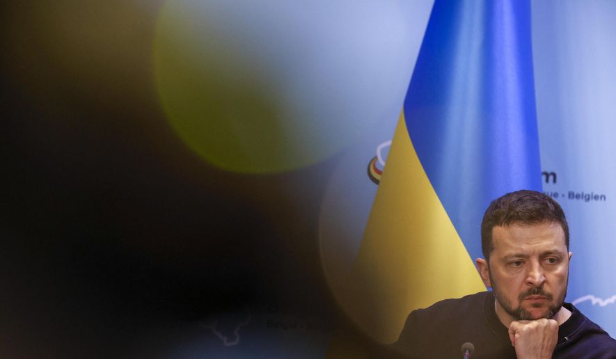 Ukraine's President Volodymyr Zelenskyy listens to a question as he talks to journalists during a joint news conference with Belgium's Prime Minister Alexander De Croo following their meeting at the prime ministers' office in Brussels, Tuesday, May 28, 2024. (AP Photo/Omar Havana)