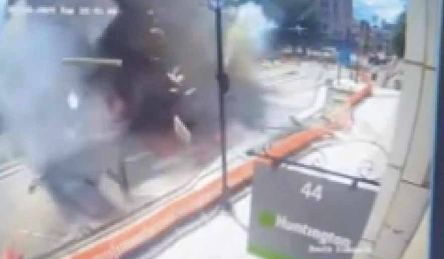 This image made from video provided by Cleveland 19 WOIO-TV shows debris flying through the air after a natural gas explosion caused extensive damage to a building in Youngstown, Ohio, Tuesday, May 28, 2024, and injured people, authorities said. (WOIO-TV via AP)