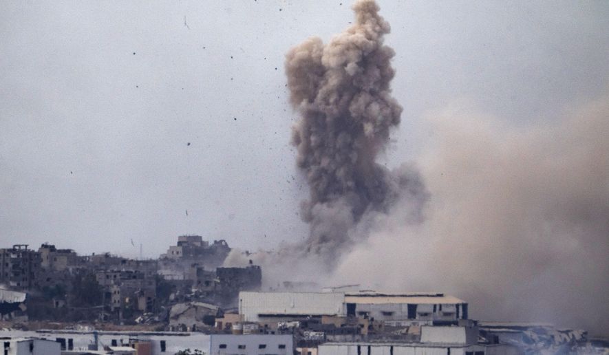 Smoke billows after an explosion in the Gaza Strip, as seen from southern Israel, Tuesday, May 28, 2024. (AP Photo/Leo Correa)