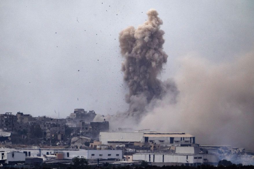 Smoke billows after an explosion in the Gaza Strip, as seen from southern Israel, Tuesday, May 28, 2024. (AP Photo/Leo Correa)