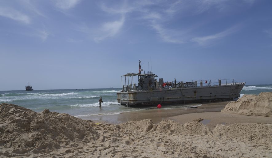 A U.S. Army landing craft is seen beached in Ashdod on Sunday, May 26, 2024, after being swept by wind and current from the temporary humanitarian pier in the Gaza Strip. (AP Photo/Tsafrir Abayov)