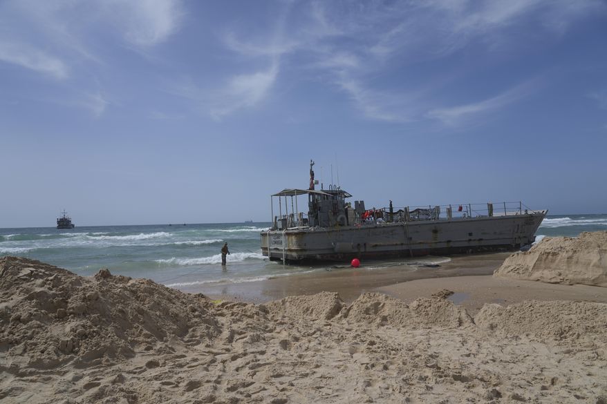 A U.S. Army landing craft is seen beached in Ashdod on Sunday, May 26, 2024, after being swept by wind and current from the temporary humanitarian pier in the Gaza Strip. (AP Photo/Tsafrir Abayov)