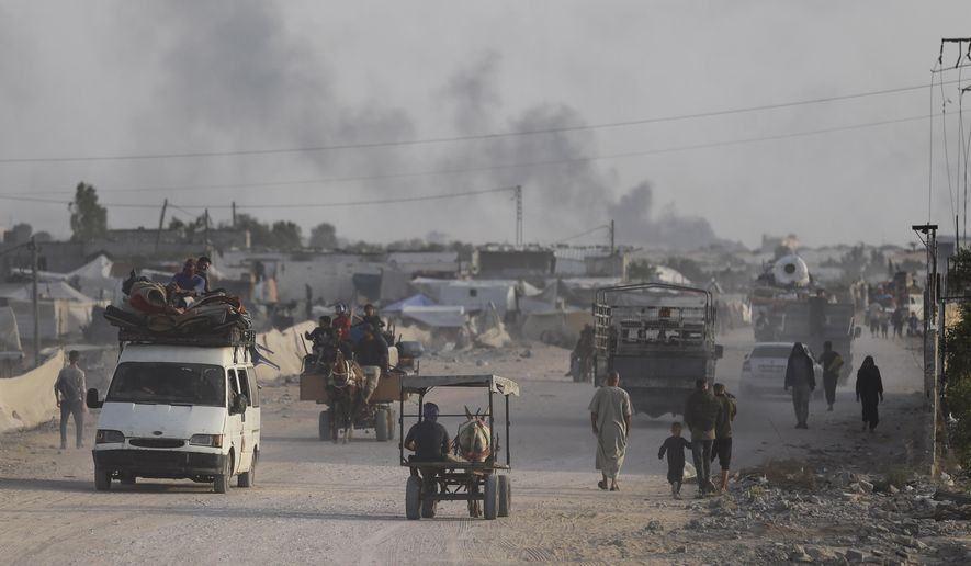 Palestinians fleeing from the southern Gaza city of Rafah during an Israeli ground and air offensive in the city on Tuesday, May 28, 2024. (AP Photo/Jehad Alshrafi)