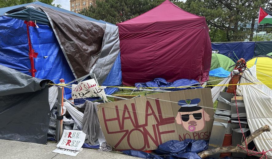 A pro-Palestinian encampment is shown Tuesday, May 28, 2024, on the campus of Wayne State University in Detroit. The school suspended in-person classes and encouraged staff to work remotely to avoid any problems with the encampment. (AP Photo/Mike Householder)