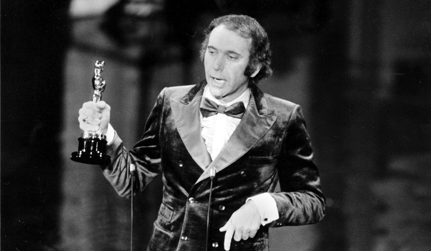 FILE - Producer Albert S. Ruddy accepts the Oscar for best picture for "The Godfather" at the 45th Annual Academy Awards ceremony in Los Angeles, Calif., on March 27, 1973. The Canadian-born producer and writer who won Oscars for “The Godfather” and “Million Dollar Baby,” died Saturday, May 25, 2024, at age 94. (AP Photo, File)