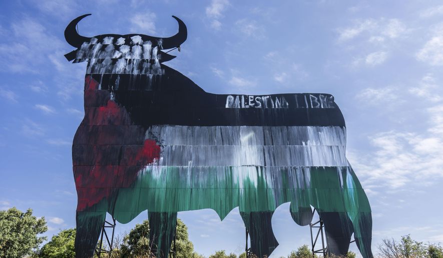 A Spanish fighting bull billboard is painted with the colours of the Palestinian flag and a writing that reads "free Palestine," on the outskirts of Madrid, Tuesday, May 28, 2024. Spain and Norway have moved to formally recognize a Palestinian state with Ireland to follow suit on Tuesday in a coordinated effort by the three western European nations. While dozens of countries have recognized a Palestinian state, none of the major Western powers has done so. (AP Photo/Bernat Armangue)