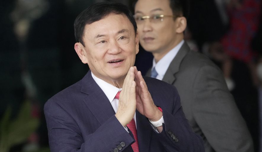 Thailand's former Prime Minister Thaksin Shinawatra, arrives at Don Muang airport in Bangkok, Thailand, Tuesday, Aug. 22, 2023. Thai prosecutors on Wednesday, May 29, 2024, said Thaksin will be indicted for defaming the monarchy, three months after he was freed on parole on other charges. (AP Photo/Sakchai Lalit, File)