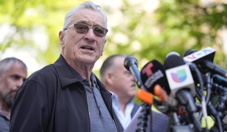 Robert De Niro speaks to reporters in support of President Joe Biden across the street from former President Donald Trump's criminal trial in New York, Tuesday, May 28, 2024. (AP Photo/Seth Wenig)