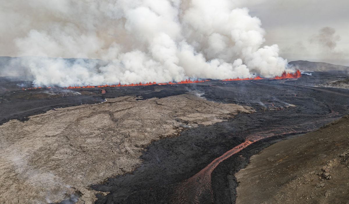 NextImg:Iceland volcano spews streams of red lava toward an evacuated town