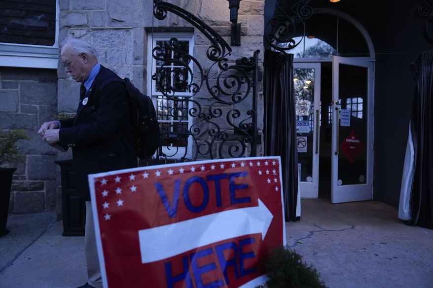 A voter leaves a polling site for the presidential primary election, March 12, 2024, in Atlanta. Fulton County, Ga.'s, election board voted on Tuesday, May 28, to certify the results of the May 21 elections. But one Republican member of the five-member board abstained after she filed a lawsuit challenging state election laws and county election rules. (AP Photo/Brynn Anderson, File)