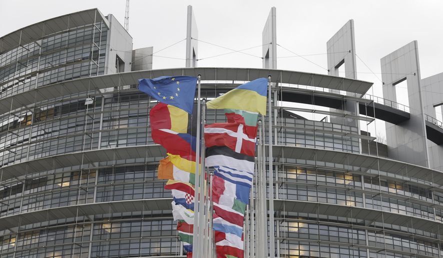 European flags fly outside the European Parliament on Feb. 7, 2024, in Strasbourg, eastern France. Some 400 million EU citizens go to the polls this weekend to elect the members of the European Parliament in one of the biggest global democratic events. (AP Photo/Jean-Francois Badias, File)
