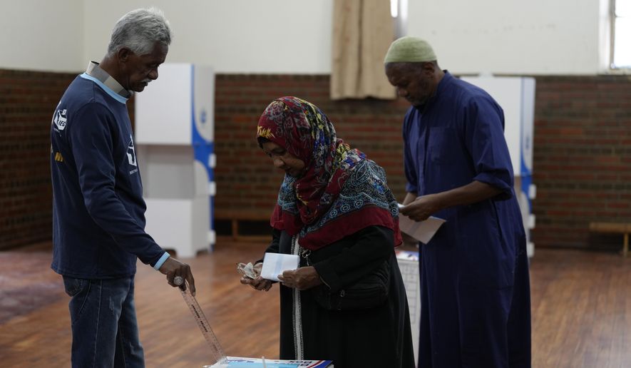 A woman casts her vote at a polling station in Cape Town, South Africa, Wednesday, May 29, 2024. South Africans have begun voting in an election seen as their country's most important in 30 years, and one that could put their young democracy in unknown territory. (AP Photo/Nardus Engelbrecht)