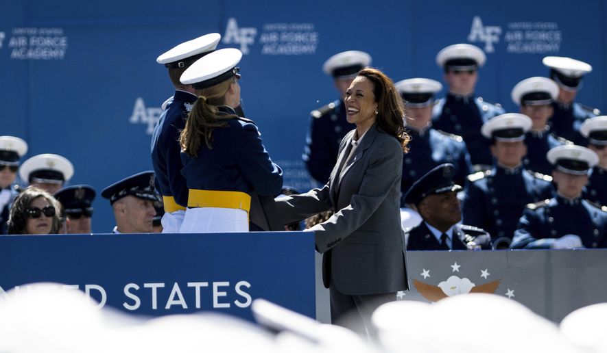 Vice President of the United States Kamala Harris accepts a gift from the class of 2024 at the United States Air Force Academy graduation at Falcon Stadium on Thursday, May 30, 2024, in Colorado Springs, Colo. (Parker Seibold/The Gazette via AP)