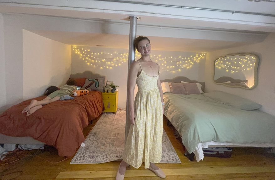 FILE - Erin Eloise Tulberg poses at home in the Brooklyn borough of New York on May 29, 2024, with her 9-year-old son. Tulberg set up a divorce registry after leaving her marriage with little more than her clothes and her books. (Erin Eloise Tulberg via AP)