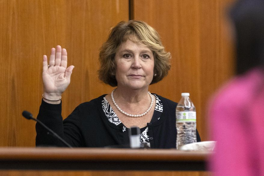 Colleton County Clerk of Court Rebecca Hill is sworn in before taking the stand to testify during the Alex Murdaugh jury-tampering hearing at the Richland County Judicial Center, Jan. 29, 2024, in Columbia, S.C. Hill faces 76 counts of ethics violations that say she used her office for personal gain. (Andrew J. Whitaker/The Post And Courier via AP, Pool, File)