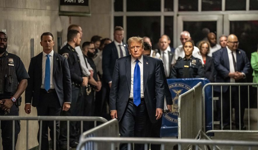 Former President Donald Trump walks out of court and toward the media following the verdict in his hush money trial, in New York, Thursday, May 30, 2024. (Mark Peterson/New York Magazine via AP, Pool)