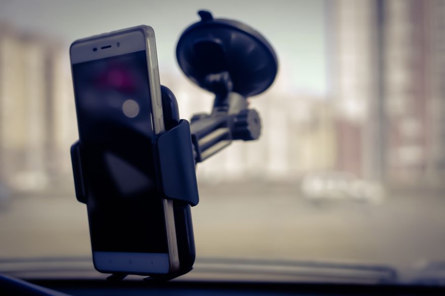 Smartphone holder in car. File photo credit: ibande via Shutterstock.