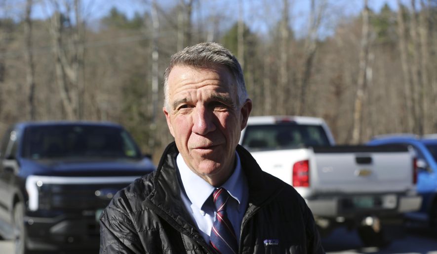 FILE - Vermont Republican Gov. Phil Scott arrives at his polling place in Berlin, Vt., on Tuesday Nov. 8, 2022. On Thursday, May 30, 2024, Vermont has become the first state to enact a law requiring fossil fuel companies to pay a share of the damage caused by climate change after the state suffered catastrophic summer flooding and damage from other extreme weather. (AP Photo/Wilson Ring, File)