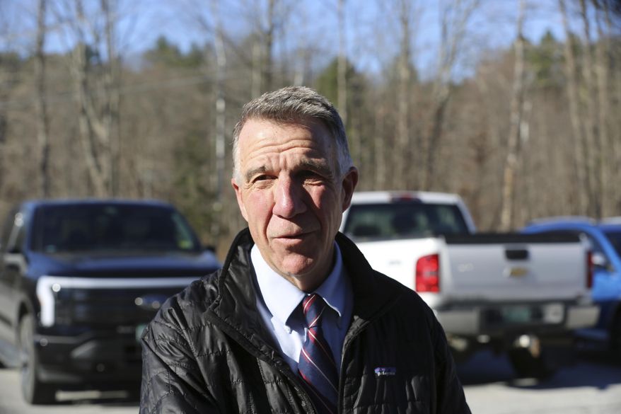 FILE - Vermont Republican Gov. Phil Scott arrives at his polling place in Berlin, Vt., on Tuesday Nov. 8, 2022. On Thursday, May 30, 2024, Vermont has become the first state to enact a law requiring fossil fuel companies to pay a share of the damage caused by climate change after the state suffered catastrophic summer flooding and damage from other extreme weather. (AP Photo/Wilson Ring, File)