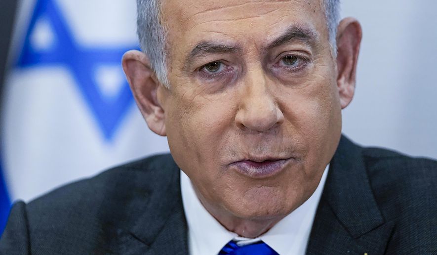 Israeli Prime Minister Benjamin Netanyahu chairs a cabinet meeting at the Kirya military base, which houses the Israeli Ministry of Defense, in Tel Aviv, Israel, on Dec. 24, 2023. Top U.S. leaders have invited Israeli Prime Minister Benjamin Netanyahu to deliver an address to Congress. The visit would provide a show of wartime support for the longtime ally despite mounting political divisions over Israel’s military assault on Gaza. The invitation from House Speaker Mike Johnson, a Republican, and Senate Majority Leader Chuck Schumer, a Democrat, and the other leaders has been in the works for some time. (AP Photo/Ohad Zwigenberg, Pool, File)
