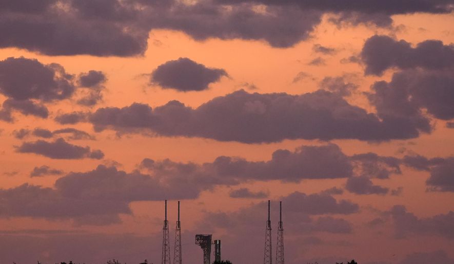 Boeing's Starliner capsule, atop an Atlas V rocket, sits on the launch pad during sunrise at Space Launch Complex 41 Saturday, June 1, 2024, in Cape Canaveral, Fla. NASA astronauts Butch Wilmore and Suni Williams will launch aboard the rocket to the International Space Station, scheduled for liftoff later Saturday. (AP Photo/Chris O'Meara)
