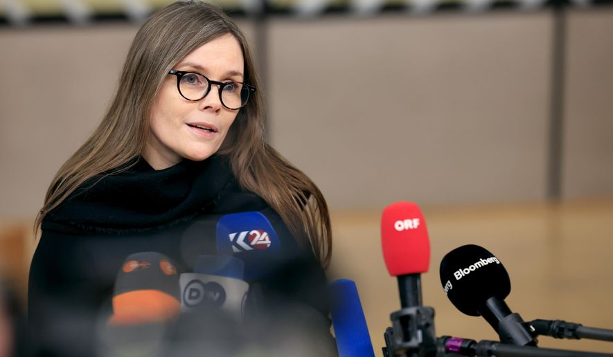 Iceland's Prime Minister Katrin Jakobsdottir speaks with the media as she arrives for an EU Summit in Brussels, on March 22, 2024. Voters in Iceland are choosing a president on Saturday, June 1, 2024 selecting from a field of 12 men and women, including former prime minister Jakobsdottir. Jakobsdottir resigned as prime minister earlier this year to run for president. (AP Photo/Geert Vanden Wijngaert, File)