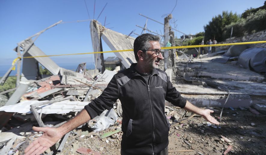 A Lebanese man gestures as he inspects a destroyed house that was hit on Friday night by an Israeli airstrike, killing one woman and wounding several other people, in the southern village of Adloun, Lebanon, Saturday, June 1, 2024. The militant Hezbollah group shot down Saturday an Israeli Hermes 900 Kochav drone over south Lebanon, after hours of Israeli drones strikes that killed at least one person and wounded others. (AP Photo/Mohammad Zaatari)