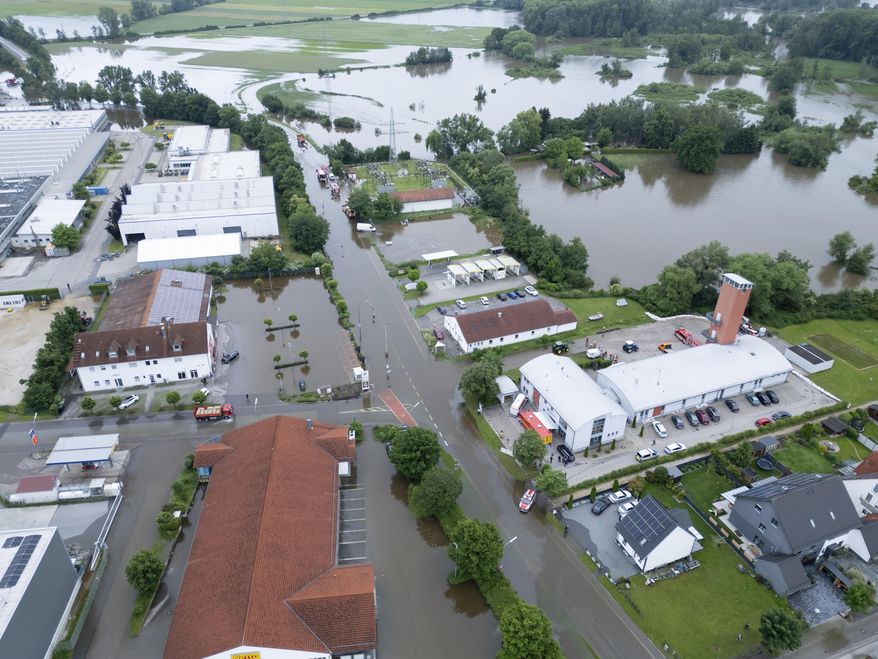 Sections of the city are flooded by water, in Reichertshofen, Germany, Sunday, June 2, 2024. (Sven Hoppe/dpa via AP)