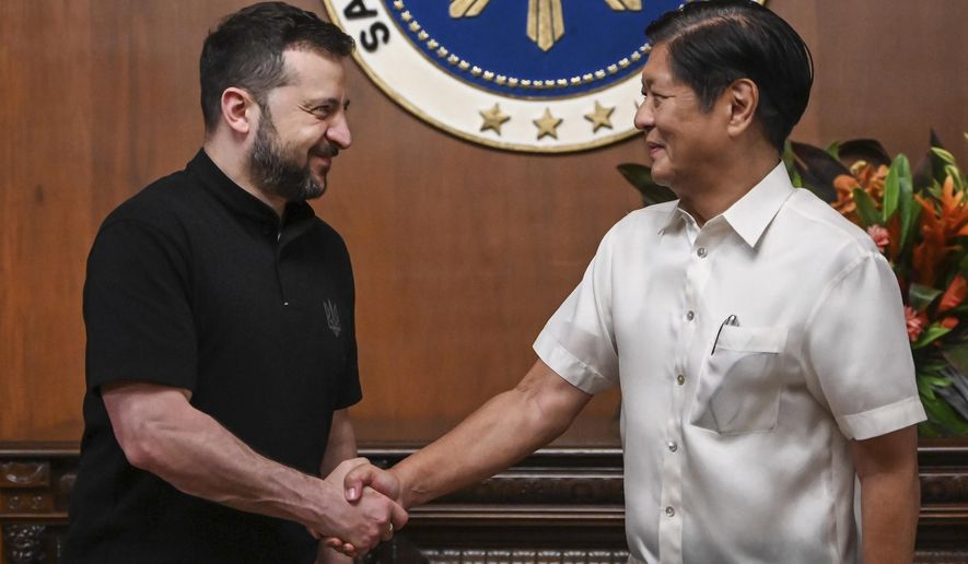 Ukraine's President Volodymyr Zelenskyy, left, meets Philippine President Ferdinand Marcos Jr. at the Malacanang presidential palace in Manila, Philippines on Monday June 3, 2024.(Jam Sta Rosa/Pool Photo via AP)