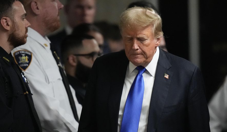 Former President Donald Trump walks to make comments to media after being found guilty on 34 felony counts of falsifying business records in the first degree at Manhattan Criminal Court, Thursday, May 30, 2024, in New York. As Trump attacked the U.S. criminal justice system following his guilty verdict, analysts say that his allegations could be useful to Russian President Vladimir Putin and other autocrats. (AP Photo/Seth Wenig, Pool, File)