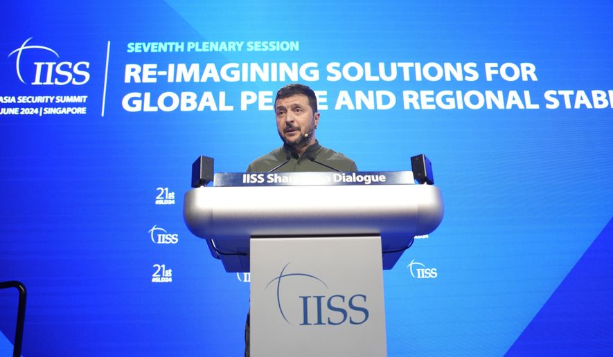 Ukraine's President Volodymyr Zelenskyy speaks during the 21st Shangri-La Dialogue summit at the Shangri-La Hotel in Singapore, Sunday, June 2, 2024. (AP Photo/Vincent Thian)